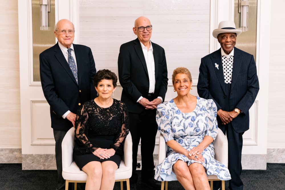 Debra Cafaro and Linda Johnson Rice, with John McCarter, Fred Eychaner and Buddy Guy standing, winner of the 2026 Making History Awards.